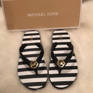 Brand New Michael Kors flip flops size 7